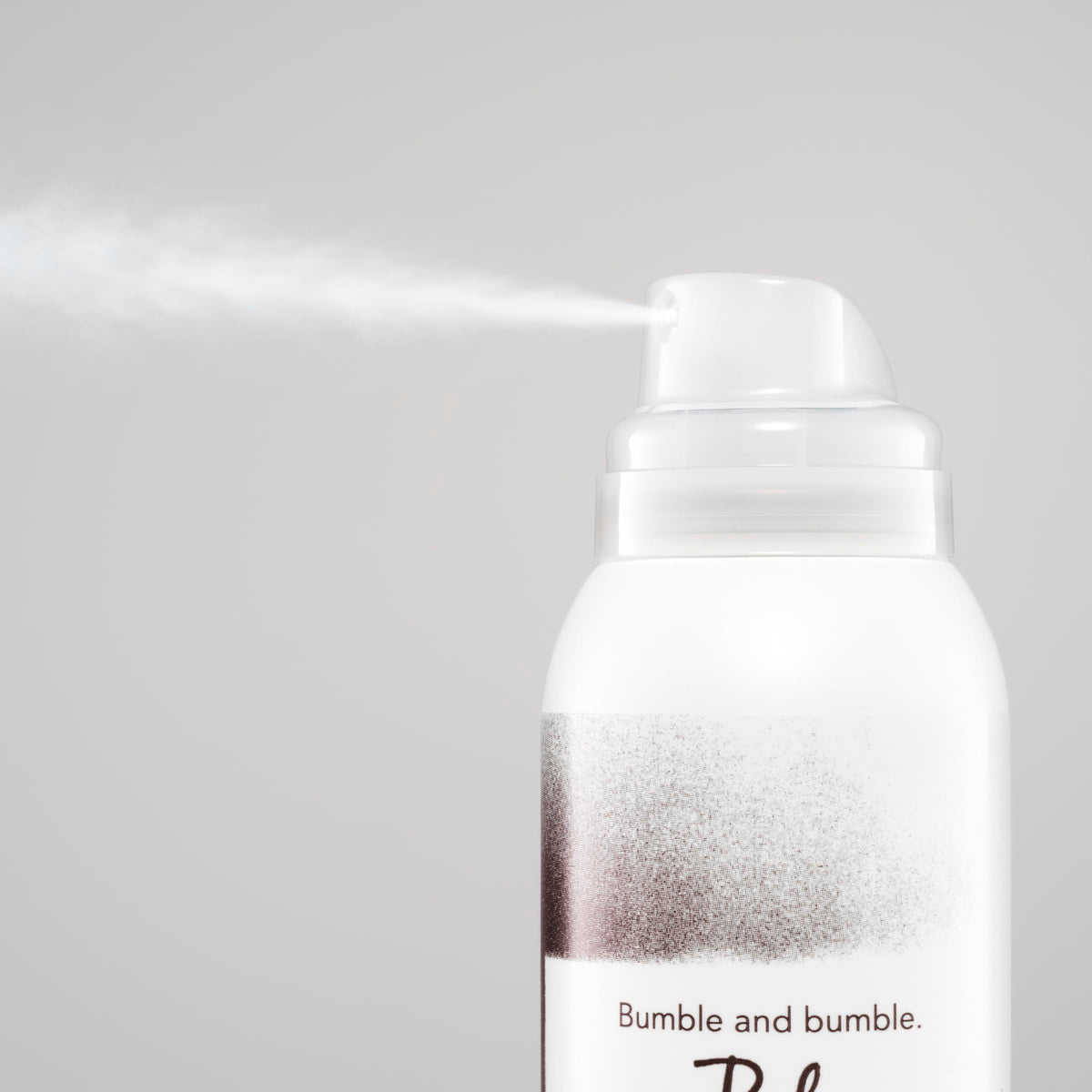 Bumble and bumble sprayed at roots demonstrating quick in‑between wash refresh