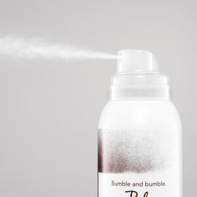 Bumble and bumble sprayed at roots demonstrating quick in‑between wash refresh