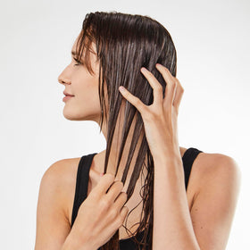 Bumble and bumble label close-up highlighting Strand-Plumping Technology