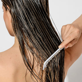 bumble and bumble creamy conditioner texture demonstrating slip