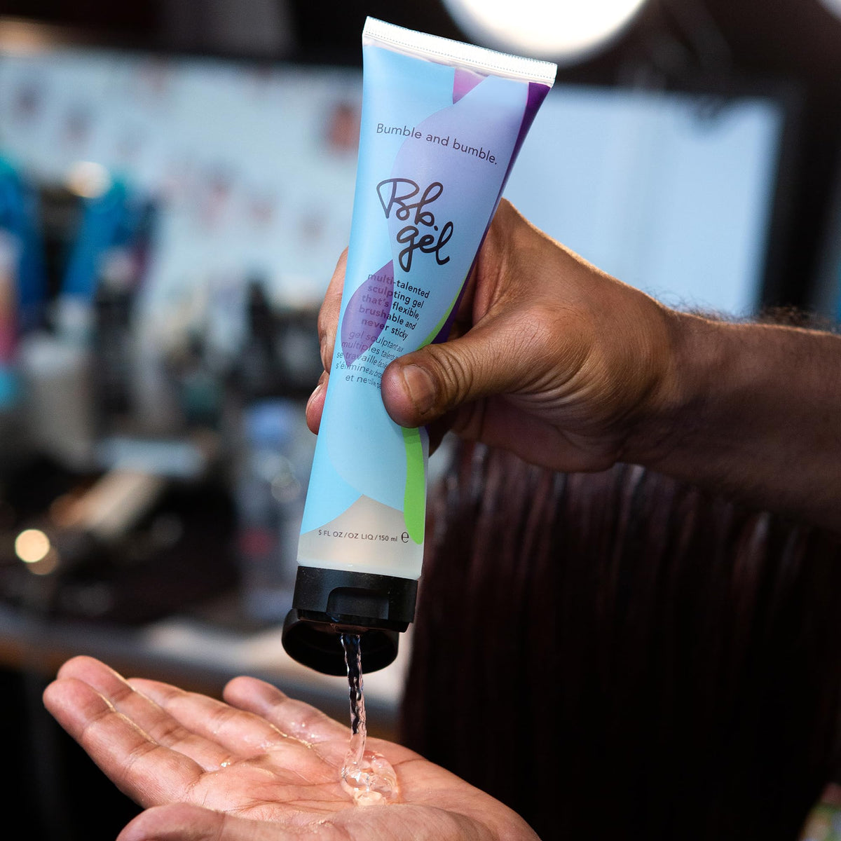 Bumble and bumble gel on fingers ready to apply for precise sculpting benefit
