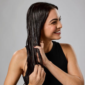 Bumble and bumble before and after hair photo illustrating smoother, shinier results
