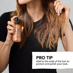 Bumble and bumble bottle in hand showing travel-friendly size benefit