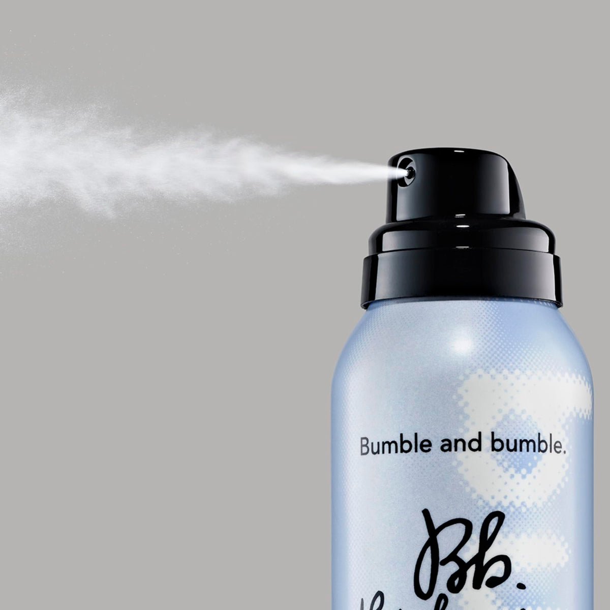 Bumble and bumble mist applied to dry hair creating instant tousled volume