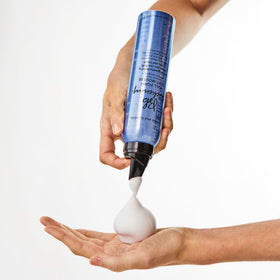 Bumble and bumble mousse on hands demonstrating easy distribution and control