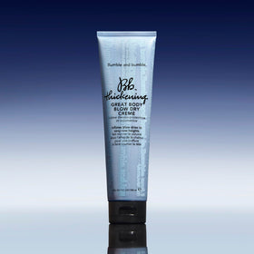 Bumble and bumble 5 fl oz tube beside hand for product scale