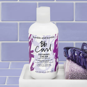 Bumble and bumble styled curls in lifestyle scene for polished look benefit