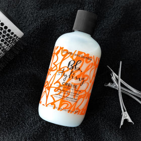 Bumble and bumble styling cream on curly hair demonstrating enhanced curl definition