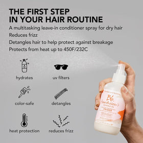 Bumble and bumble stylist applying primer before heat styling to protect hair