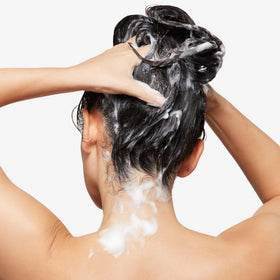 Bumble and bumble shampoo in shower use demonstrating lather and rinse benefit