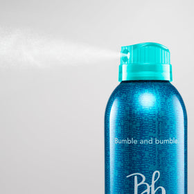 Bumble and bumble texture close-up showing soft, touchable hair finish and shine benefit