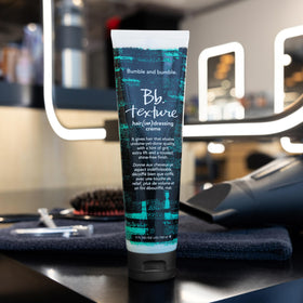 Bumble and bumble on a bathroom shelf lifestyle shot showing everyday styling convenience