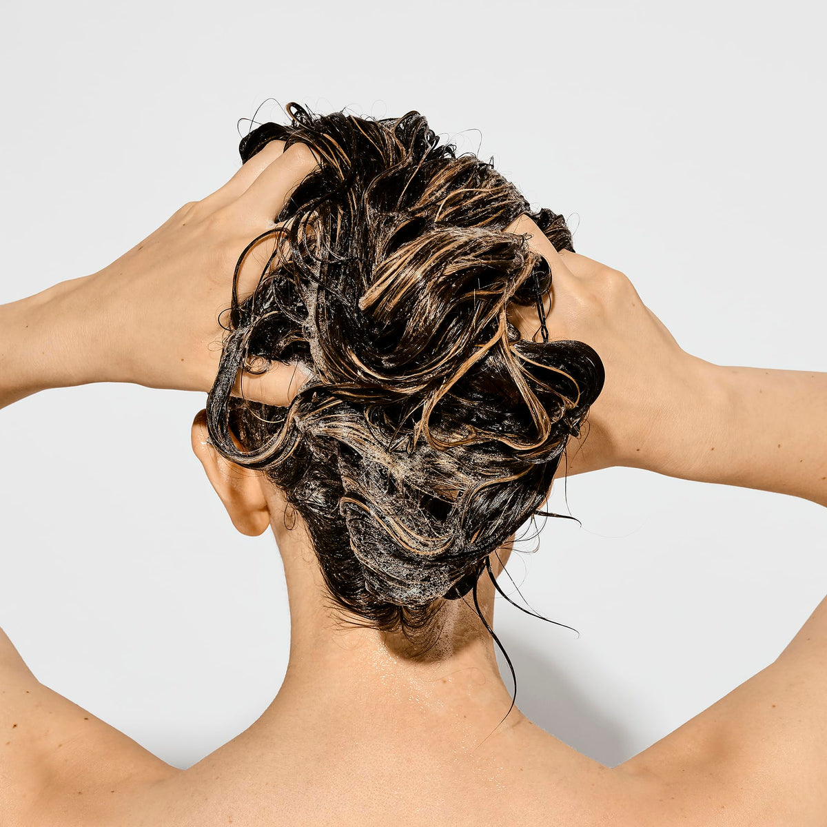 Bumble and bumble creamy shampoo texture showing gentle restorative feel