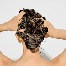 Bumble and bumble creamy shampoo texture showing gentle restorative feel