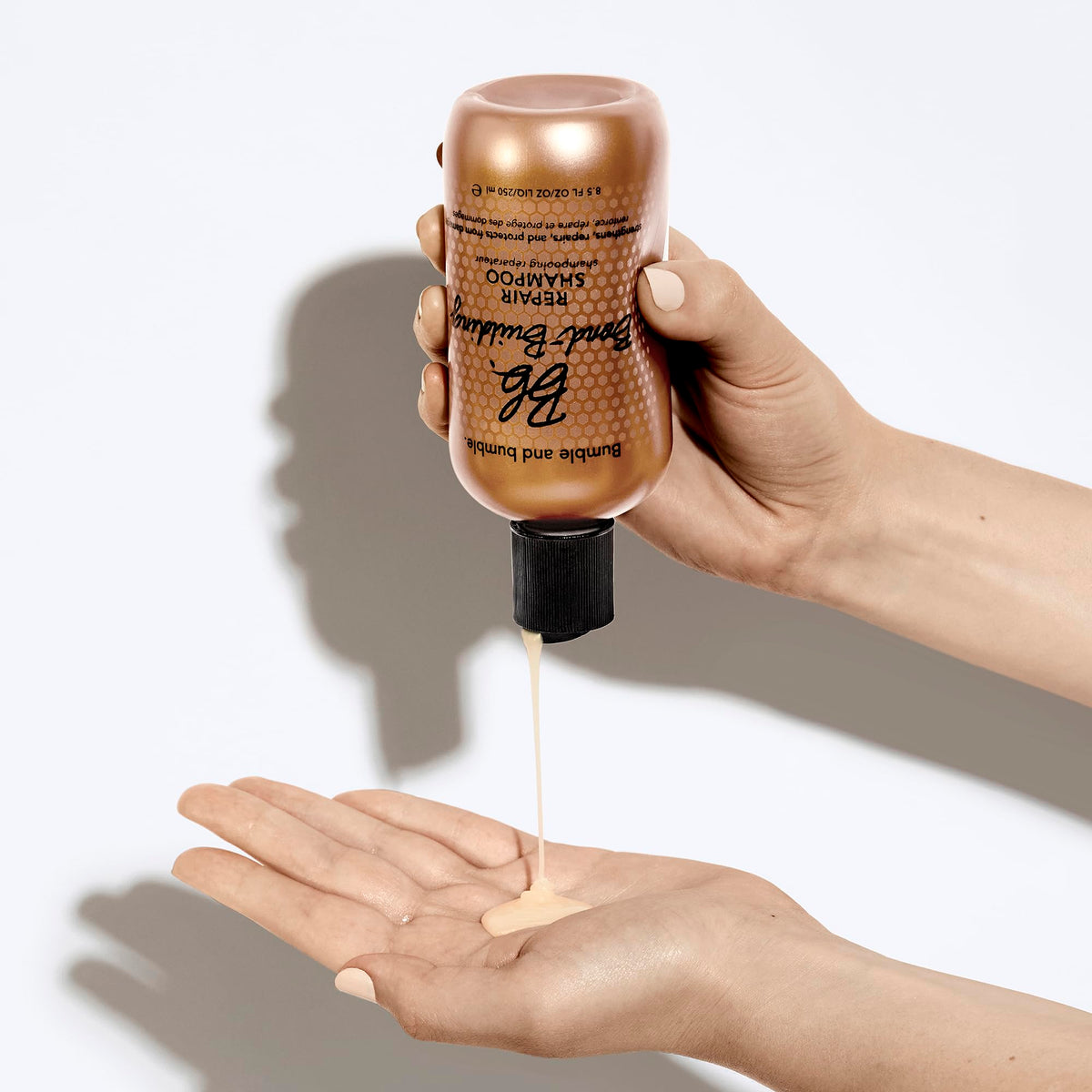 Bumble and bumble bottle in hand demonstrating easy daily use and control