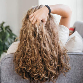 Burlybands being removed easily from hair showing no tug or damage benefit