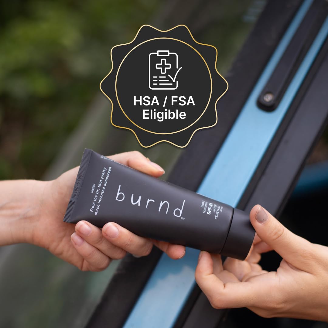burnd placed with sunglasses on sand, brand suggesting beach and outdoor readiness