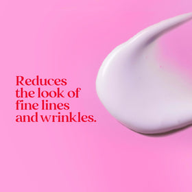 Burt's Bees applying serum to dark spot demonstrating targeted correction benefit
