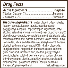 Burt's Bees tube beside ruler indicating 1.7 oz size for travel-friendly convenience