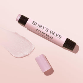 Burt's Bees next to a coin for size comparison and pocket-friendly benefit
