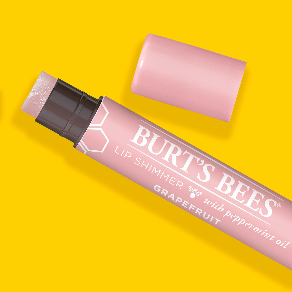 Burt's Bees in a purse pocket showing compact size and on-the-go convenience