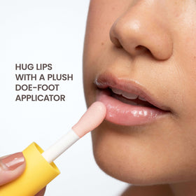 Burt's Bees ingredients display with jojoba and almond, emphasizes nourishing oils