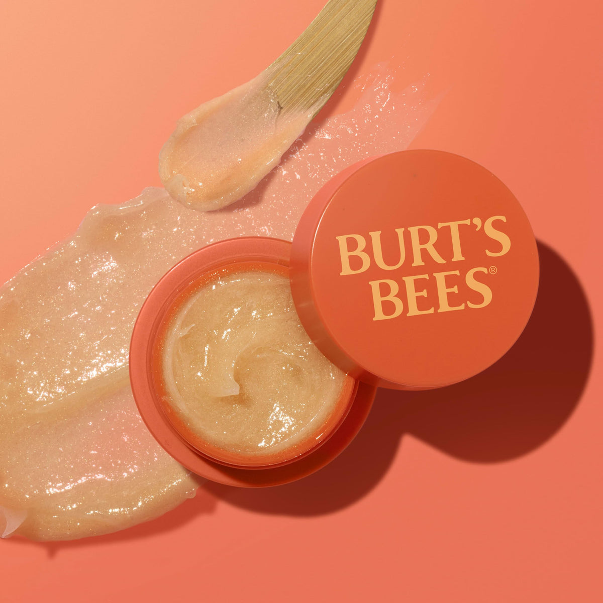 Burt's Bees jar on bedside table in lifestyle scene suggesting nightly routine benefit