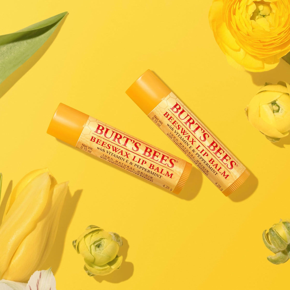 Burt's Bees lifestyle on desk, keeps lips hydrated at work