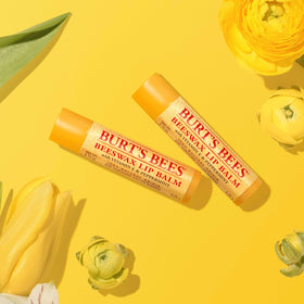Burt's Bees lifestyle on desk, keeps lips hydrated at work