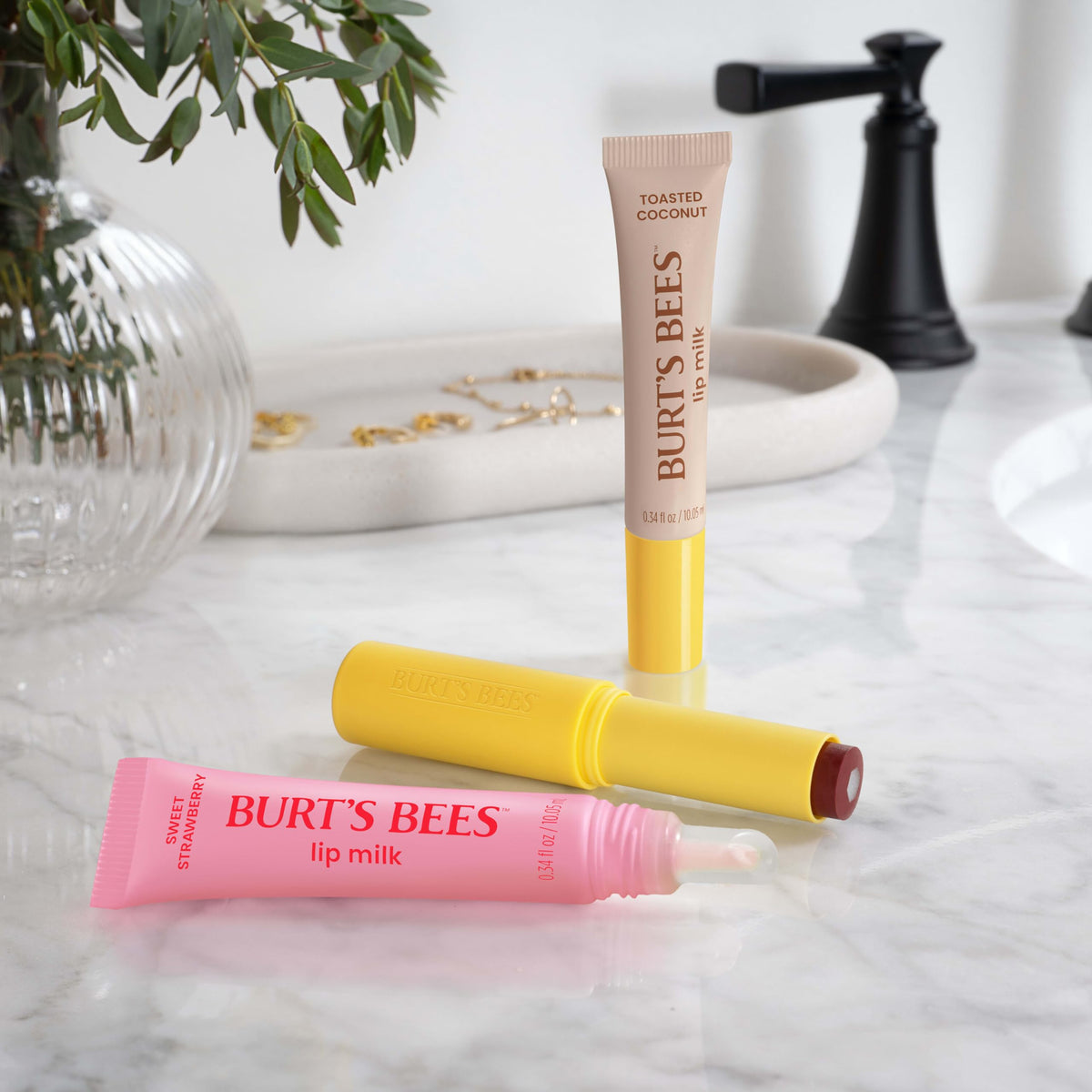 Burt's Bees tube inside purse illustrating on-the-go hydration