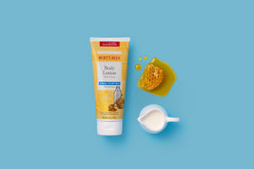 Burt's Bees lotion applied to forearm showing visible skin softening benefit