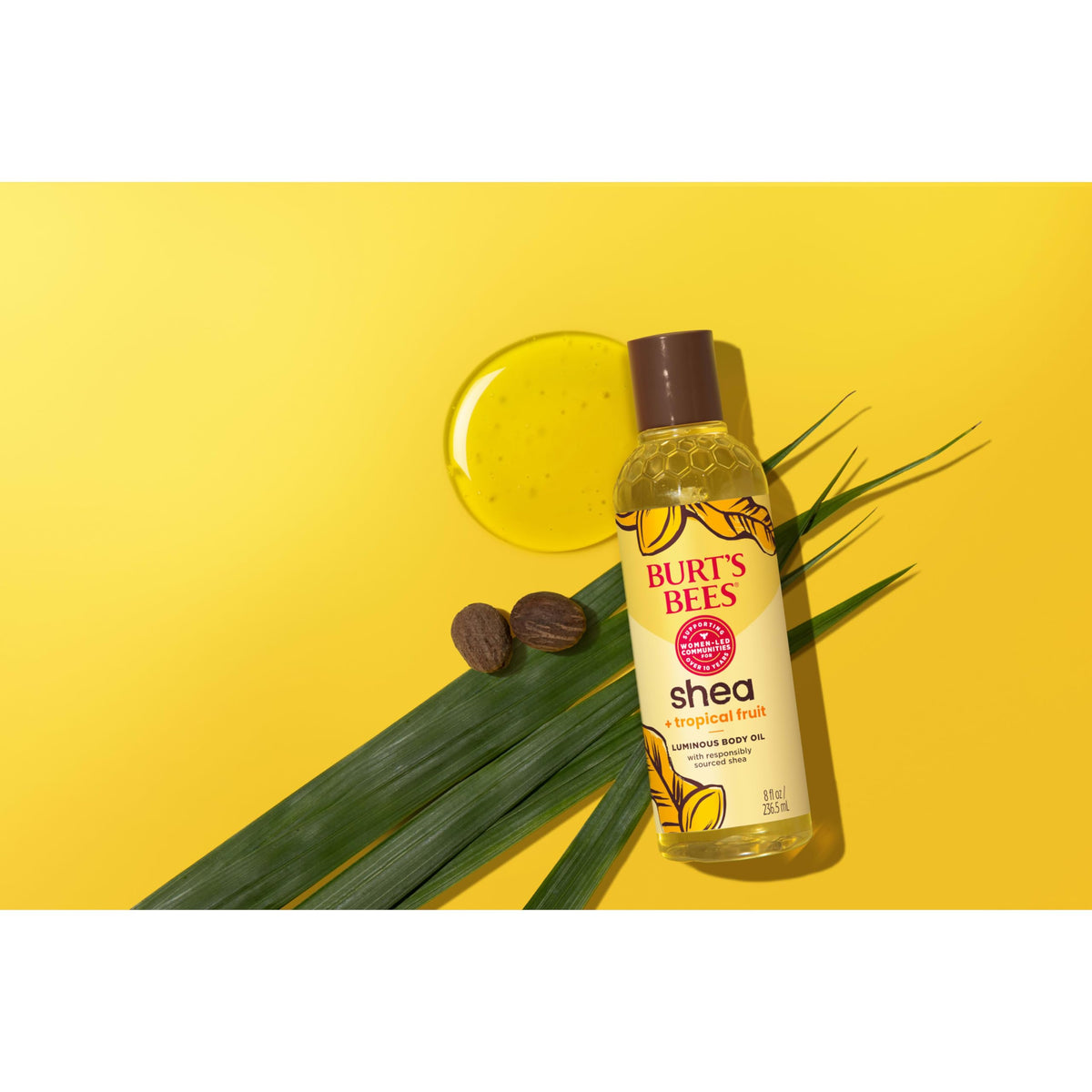 Burt's Bees oil staged in a travel kit on a vanity for on-the-go moisturization