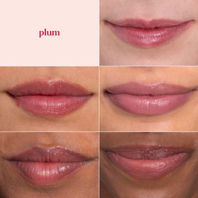 Burt's Bees plum in hand scale showing travel-friendly size and pocket convenience