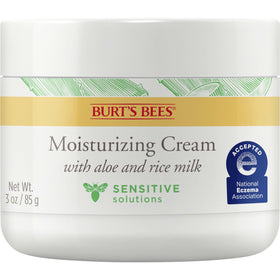 Burt's Bees jar in hand showing 3 oz scale for travel convenience