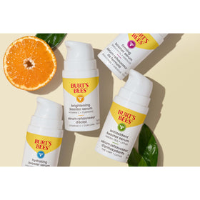 Burt's Bees applying serum to hand demonstrating easy absorption benefit