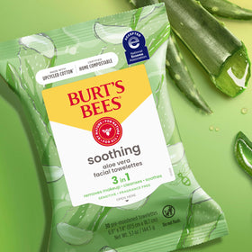 Burt's Bees wipe held next to hand showing size and coverage for efficient removal