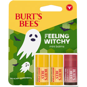 Burt's Bees mini tube next to a coin showing compact travel-friendly size