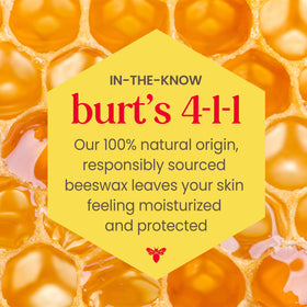 Burt's Bees tube next to coin showing compact, travel-ready size