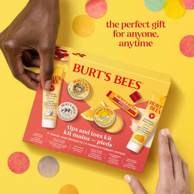 Burt's Bees travel-ready layout in a purse and toiletry bag, convenient for trips