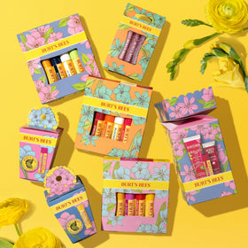 Burt's Bees Tropical Pineapple tube held in hand for size and travel convenience