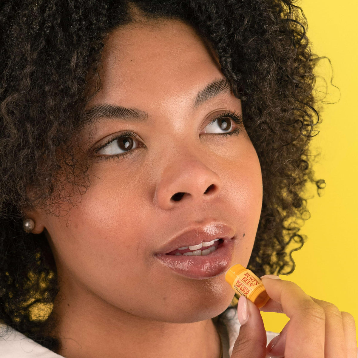 Burt's Bees tube cap and label detail highlighting natural-origin ingredients and clean formula