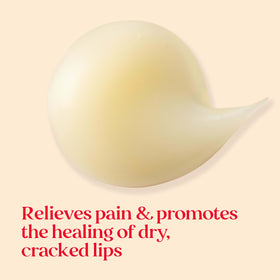 Burt's Bees tubes held in hand illustrating compact size and portability