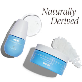 Bushbalm scrub and oil styled on a bath tray, suggesting an easy post-shave routine benefit