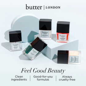 butter LONDON lifestyle flatlay conveying clean, 10-free beauty benefit