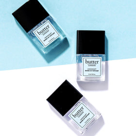 butter LONDON on a vanity with tools showing salon-quality results