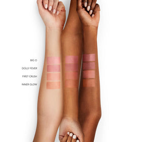 BUXOM Dolly Fever being applied to lips delivering instant moisture and subtle plump