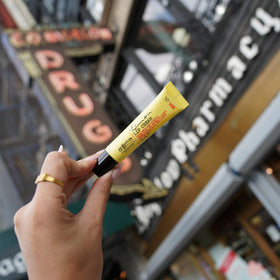 C. O. Bigelow tube in hand demonstrating compact size and travel readiness