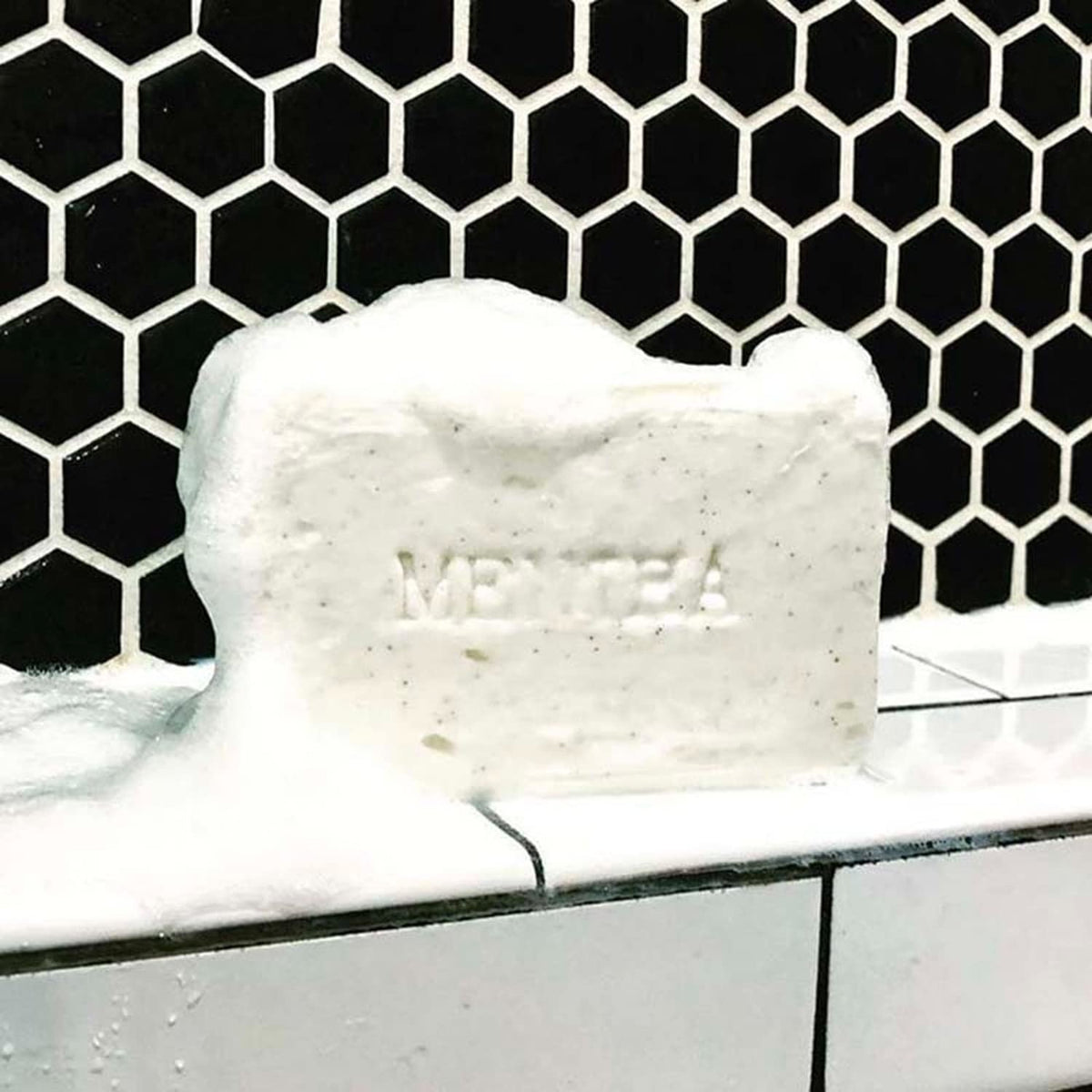 C. O. Bigelow mentha two-bar pack beside soap dish for size and gift-ready convenience