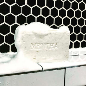 C. O. Bigelow mentha two-bar pack beside soap dish for size and gift-ready convenience