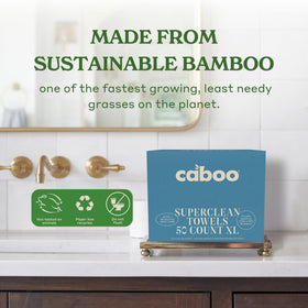 Caboo towel held in hand to show true 10x11.5 inch scale